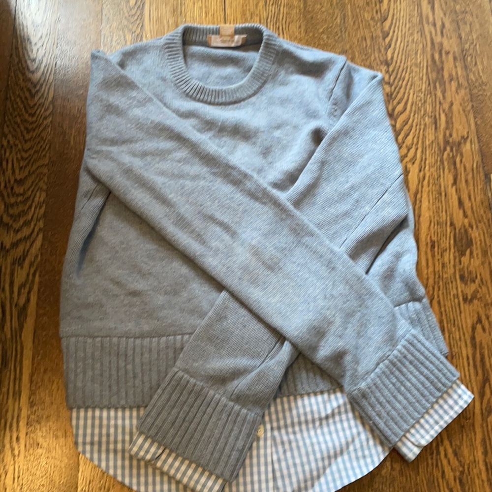 Light blue sweater with button down detail